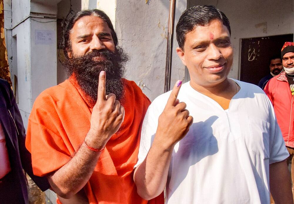 Yoga Guru Baba Ramdev and Acharya Balkrishna at polling center in Haridwar.
