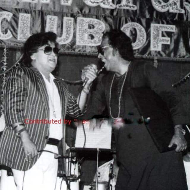 Bappi Lahiri and Kishore Kumar performing at a concert together