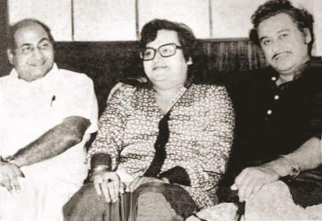 Bappi Lahiri poses with Mohammad Rafi and Kishore Kumar