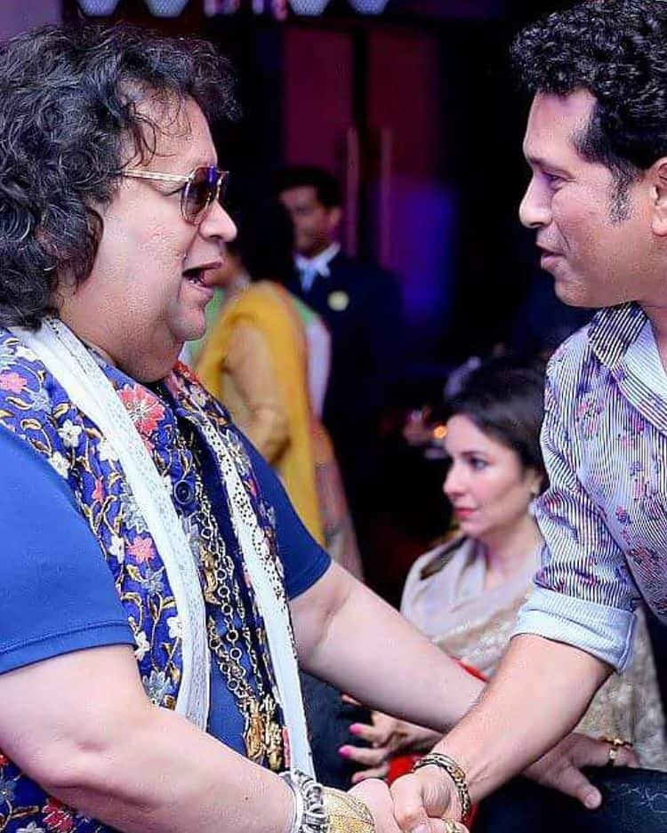 Bappi Lahiri smiles as he meets Sachin Tendulkar