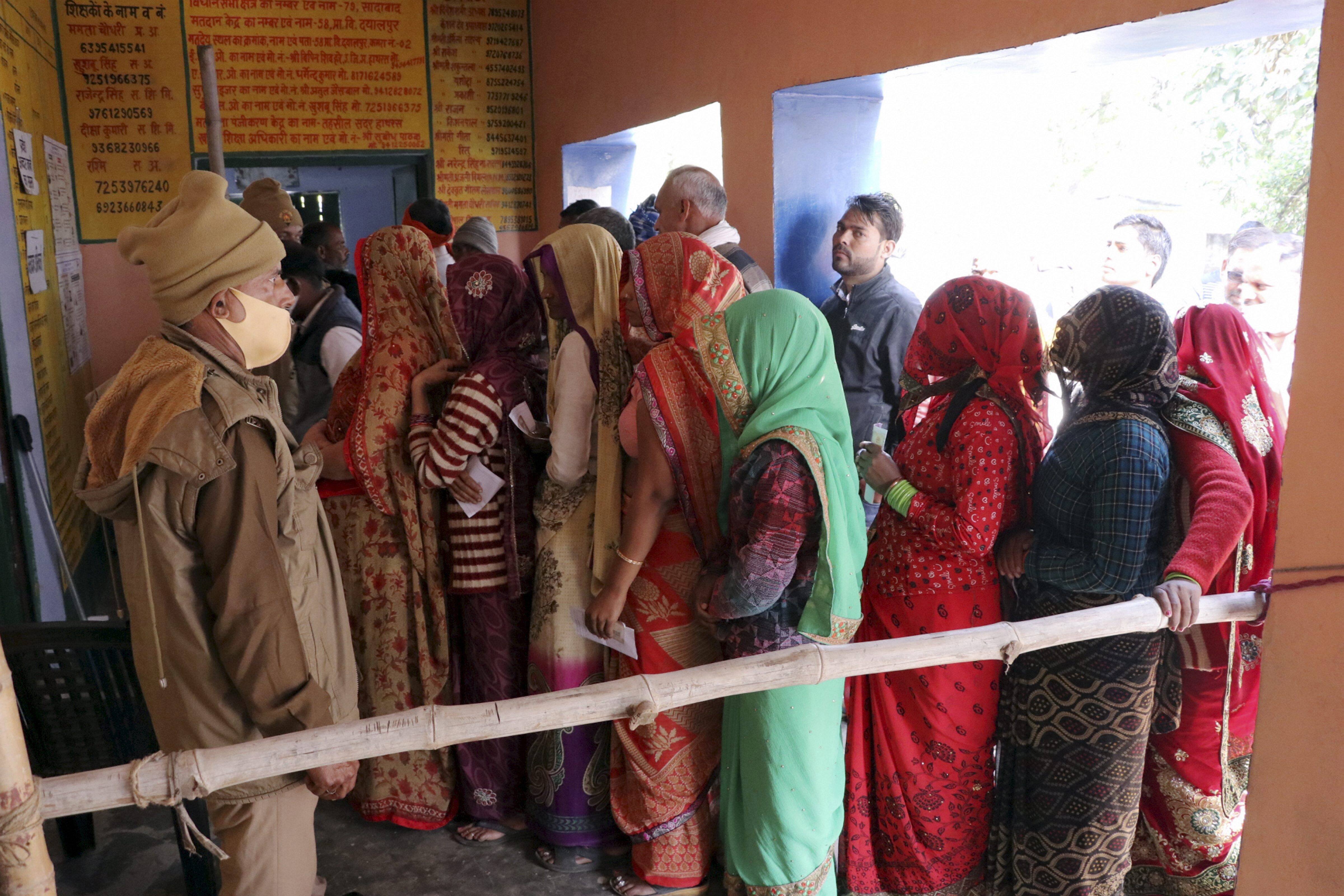 Locals in Hathras waiting in a queue to vote.