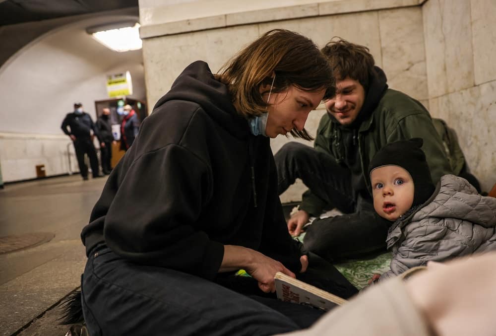 Civilians gather at a metro station to escape air strikes in Ukraine