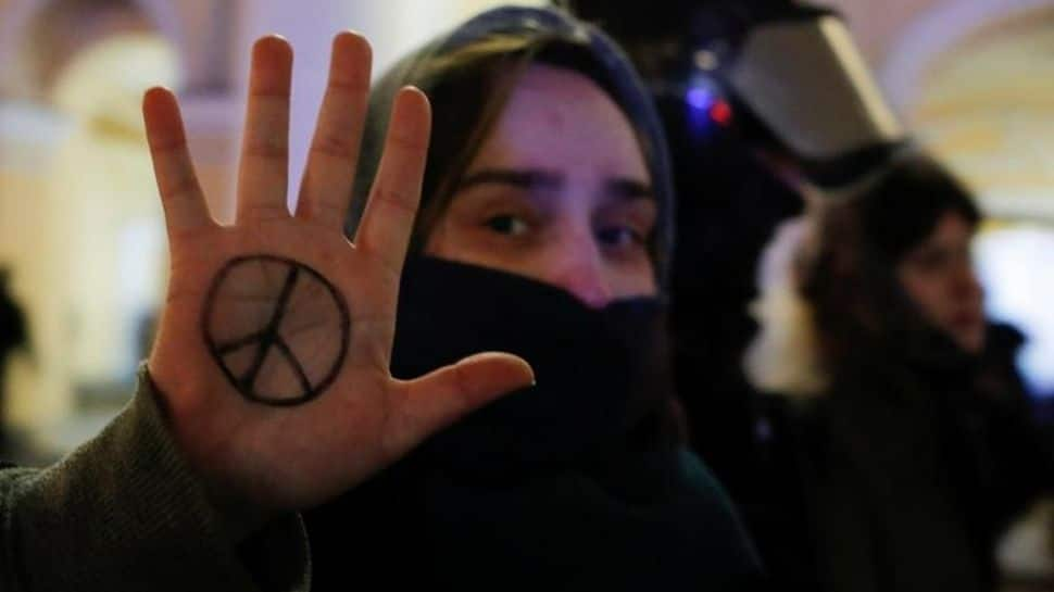 Protester shows peace sign in Saint Petersburg