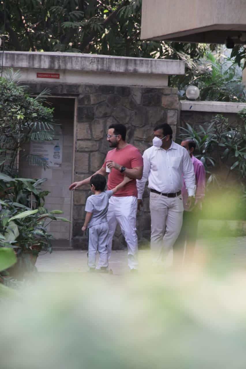 Saif Ali Khan holds Taimur's hand