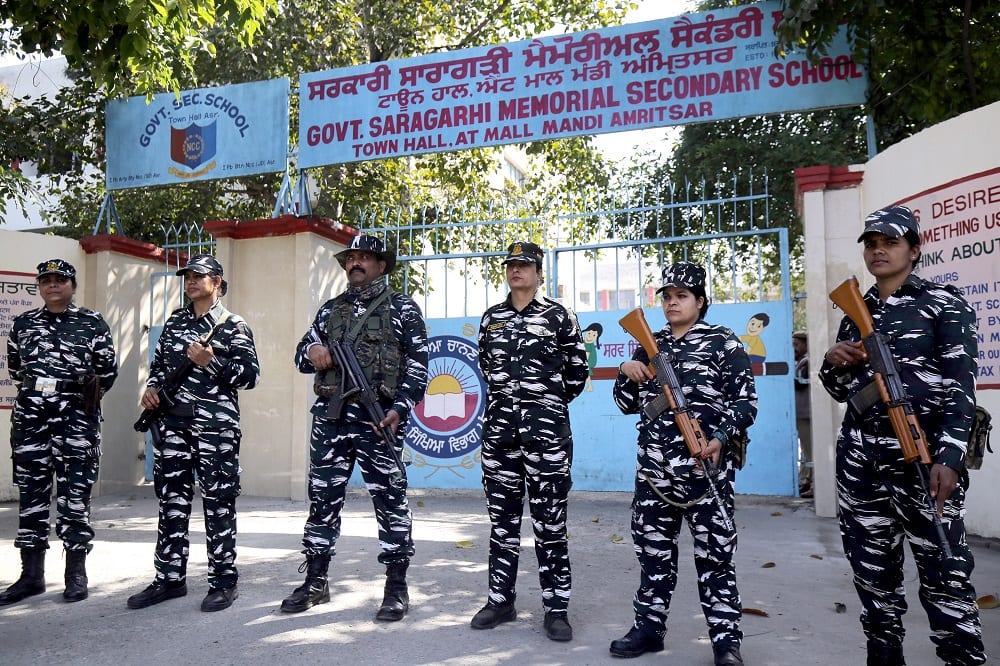 Paramilitary personnel stand guard outside counting station in Amritsar