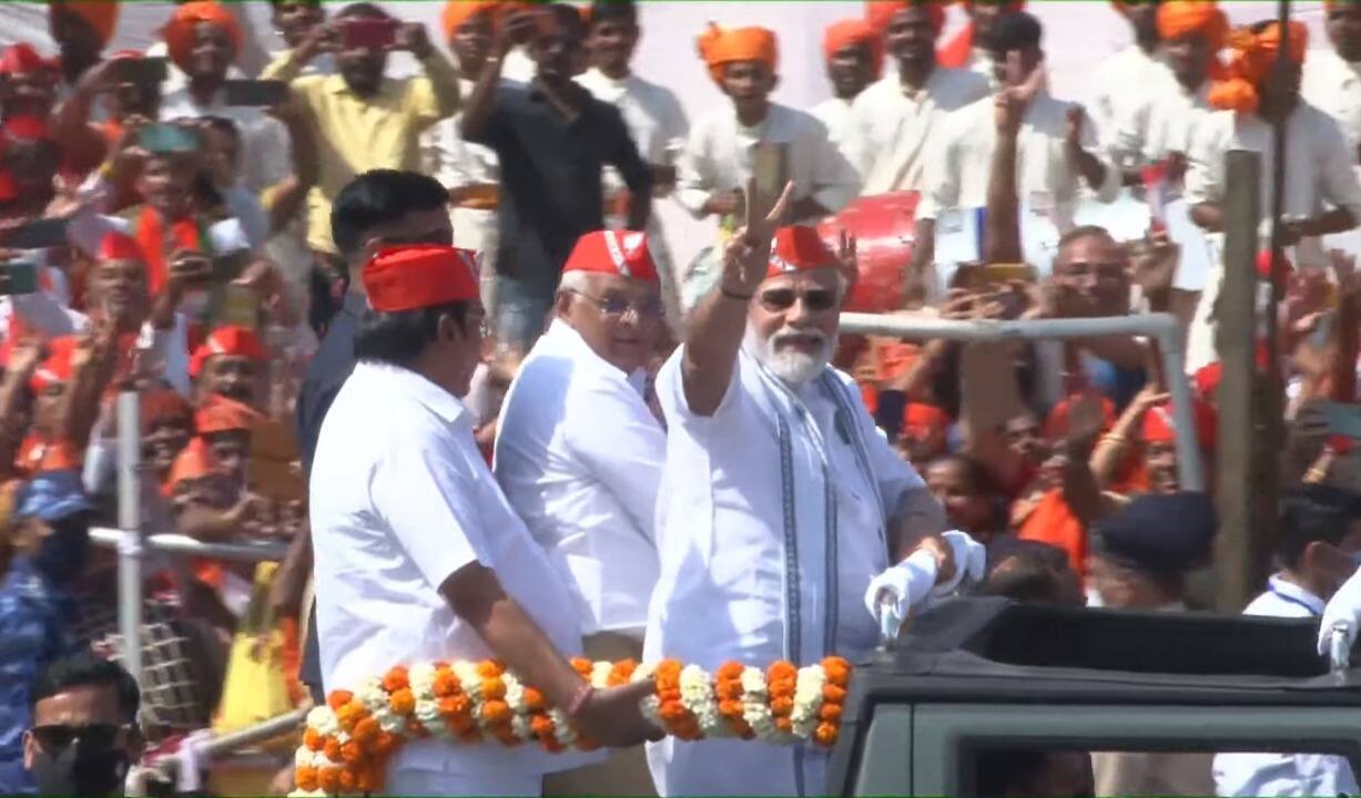 PM Modi greets people with victory sign in Gujarat after assembly election 2022 result