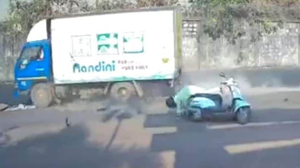 Watch: Woman riding scooter gets hit by truck, helmet saves life