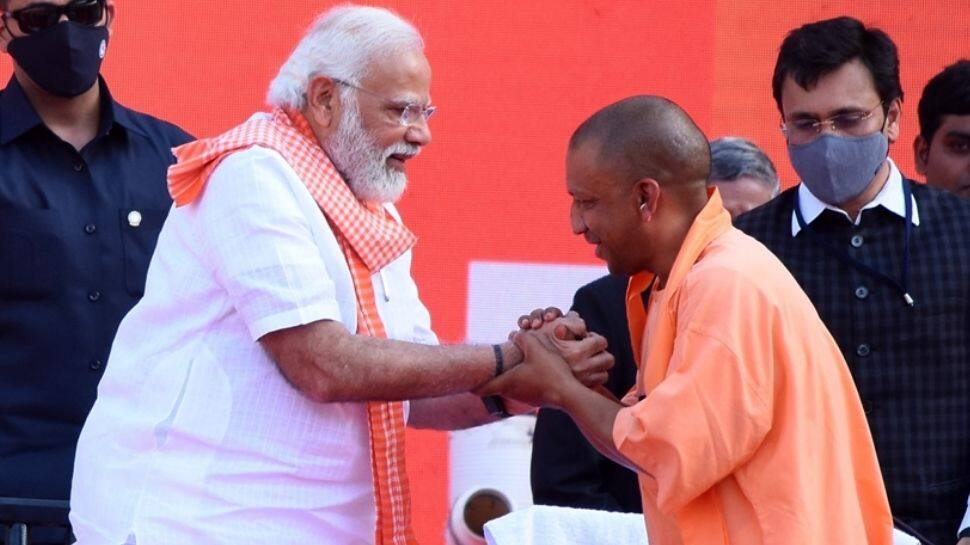 PM Modi greets CM Yogi Adityanath and his ministers on taking oath