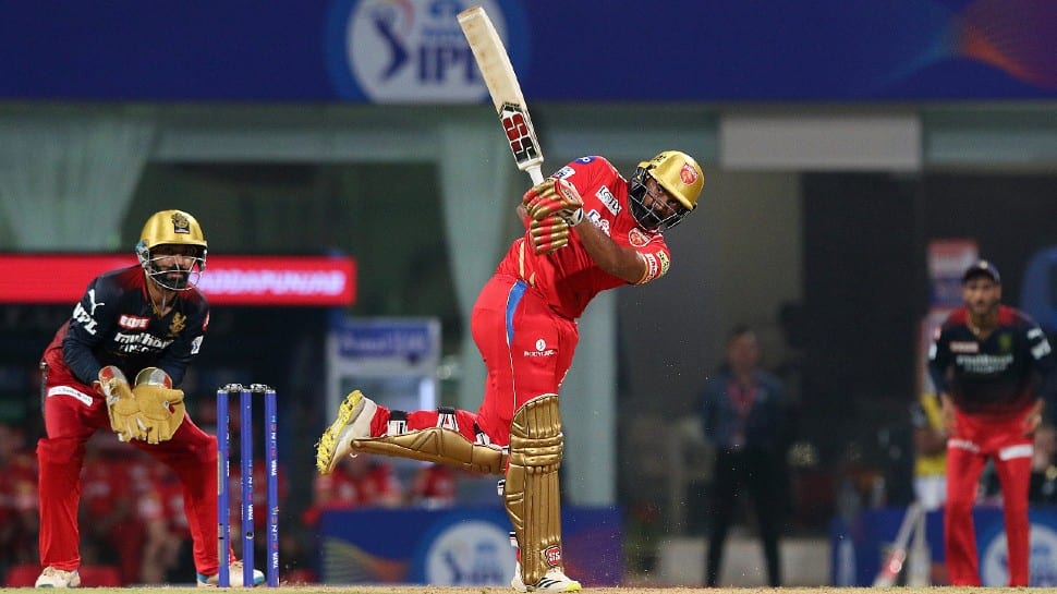 Punjab Kings batter Bhanuka Rajapaksa hits a big shot against Royal Challengers Bangalore in their IPL 2022 match. The Kings registered their joint-highest run chase in a winning cause. They achieved the same target of 206 previously against SRH and CSK in 2014. (Photo: PTI)