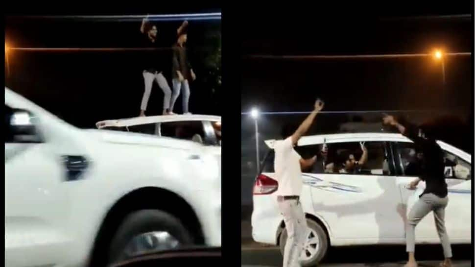 Watch: Ghaziabad youths dance on car roof, police nab them, send challan home | India News | Zee News