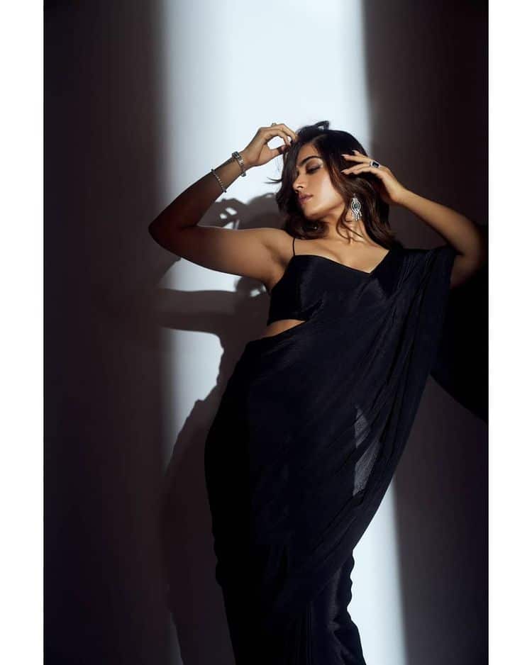 Rashmika oozes oomph in a plain black saree