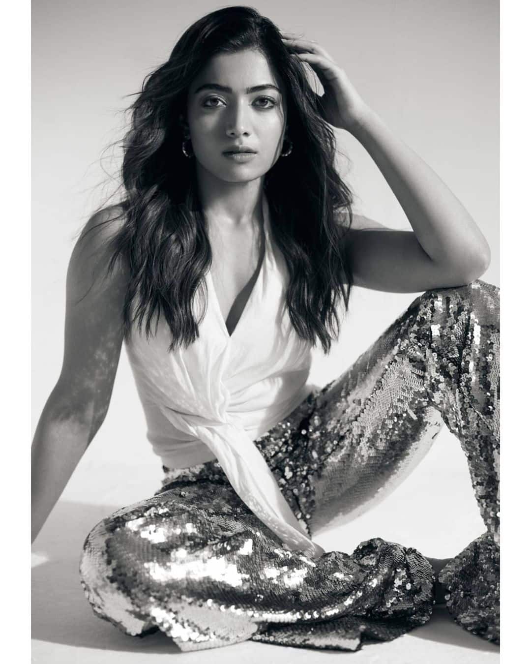 Rashmika looks party ready in white top paired with sequined pants