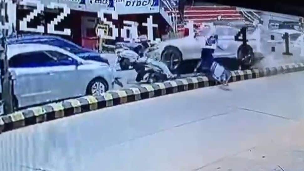 Scary CCTV footage shows speeding BMW crossing divider, hitting scooter rider in Mangalore [Video]
