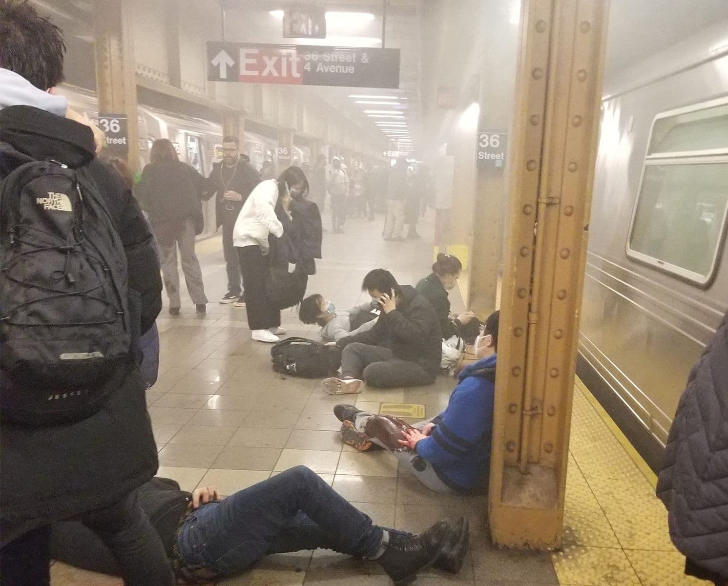 Wounded people lie at subway station in NYC