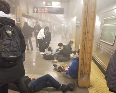 Wounded people lie at subway station in NYC