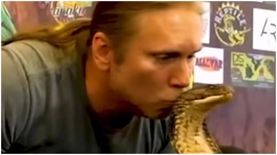 Bizarre! Man kisses most poisonous snake, King Cobra, WATCH what happens next