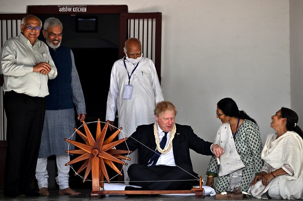 UK PM Boris Johnson tries his hands on charkha in Gujarat's Sabarmati Ashram