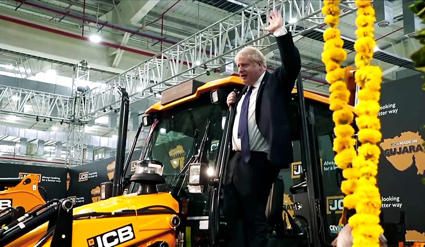 UK PM Boris Johnson hops on a JCB bulldozer during his India visit