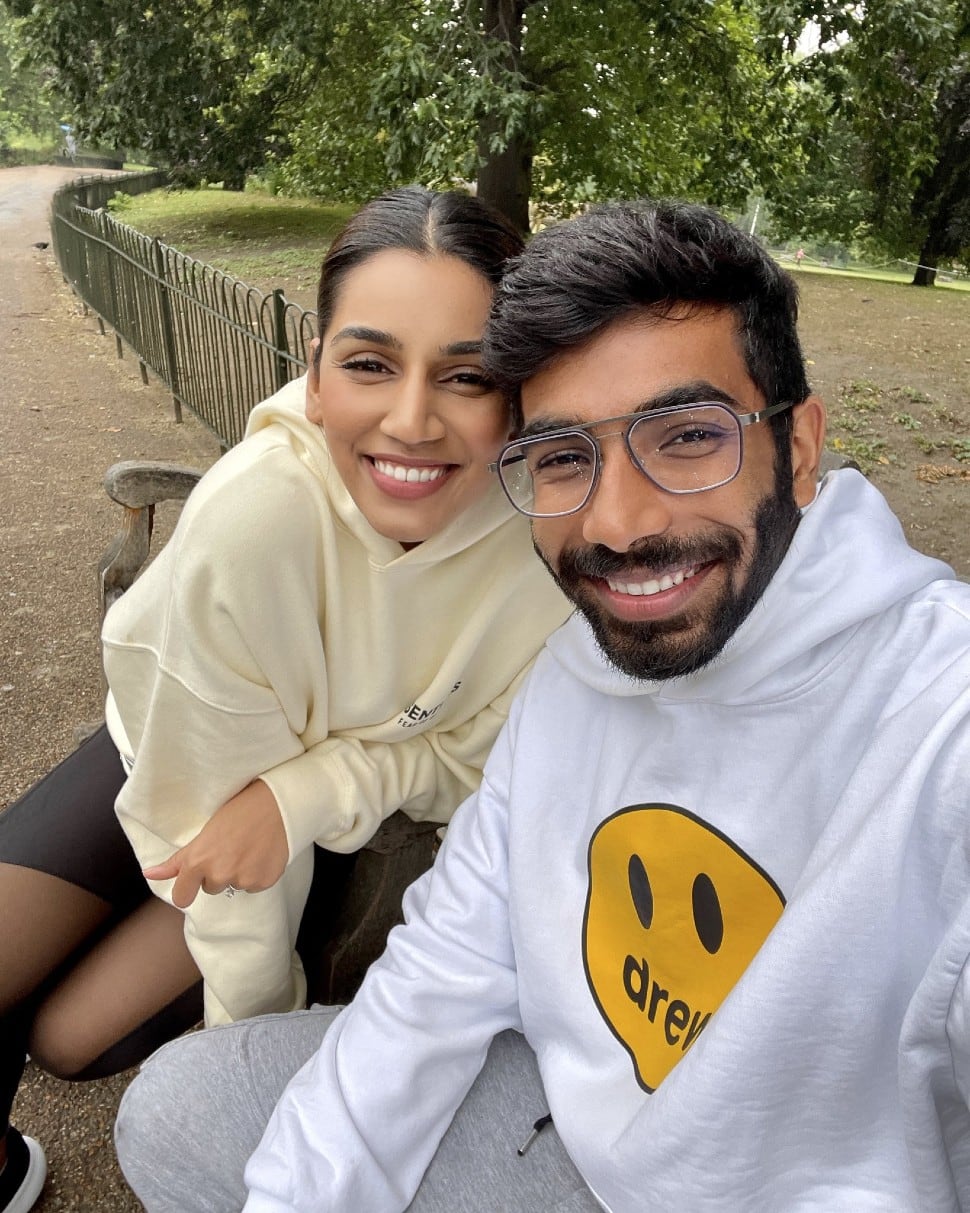 Sanjan Ganesan and Jasprit Bumrah enjoy the sun in a London park. (Source: Twitter)