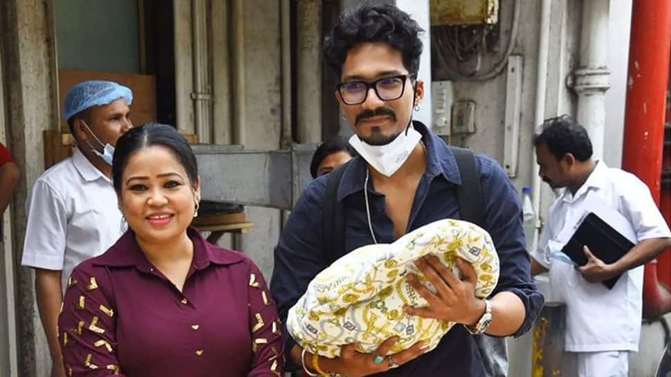 Bharti Singh, hubby Haarsh Limbachiyaa cradle baby boy in arms, hide his face as he turns a month old in THESE pics!