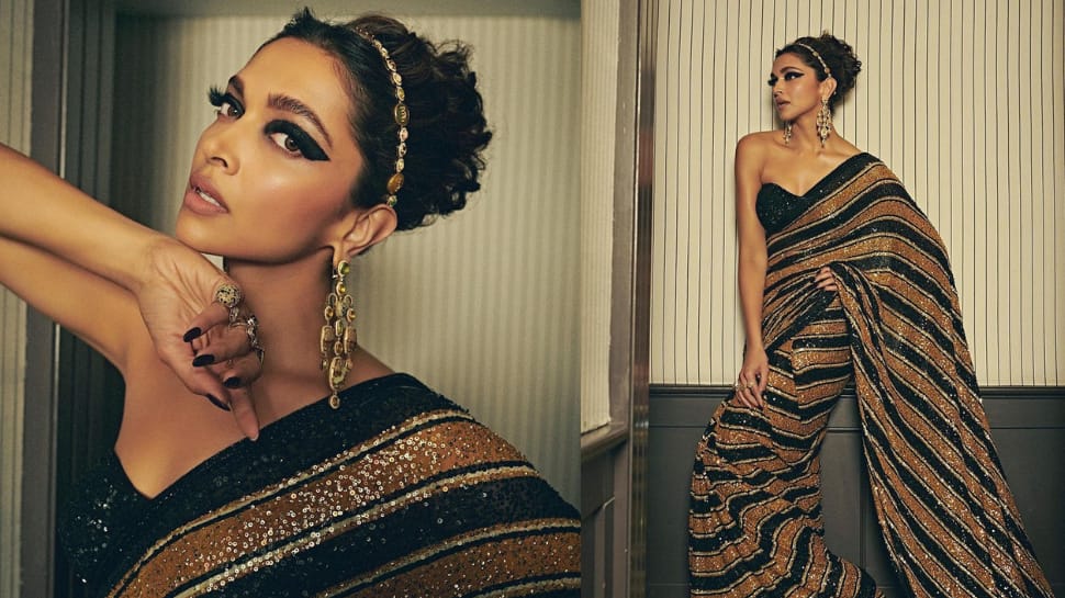 Deepika Padukone wears a shimmery black and gold Sabyasachi saree