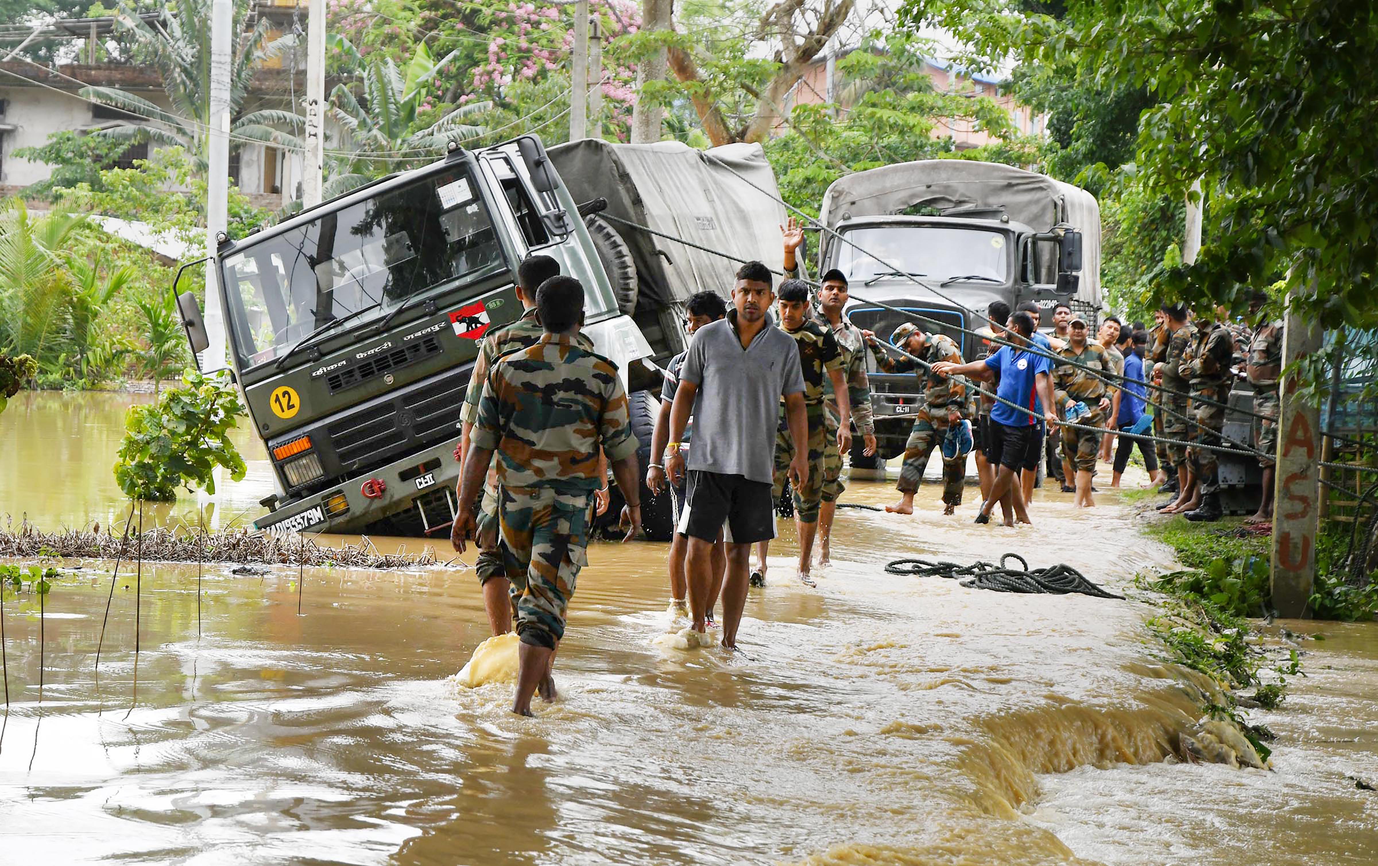 write a newspaper report on flood in assam