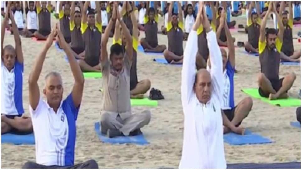 International Yoga Day 2022: Defence Minister Rajnath Singh joins in yoga session with Navy personnel at Karwar Naval Base