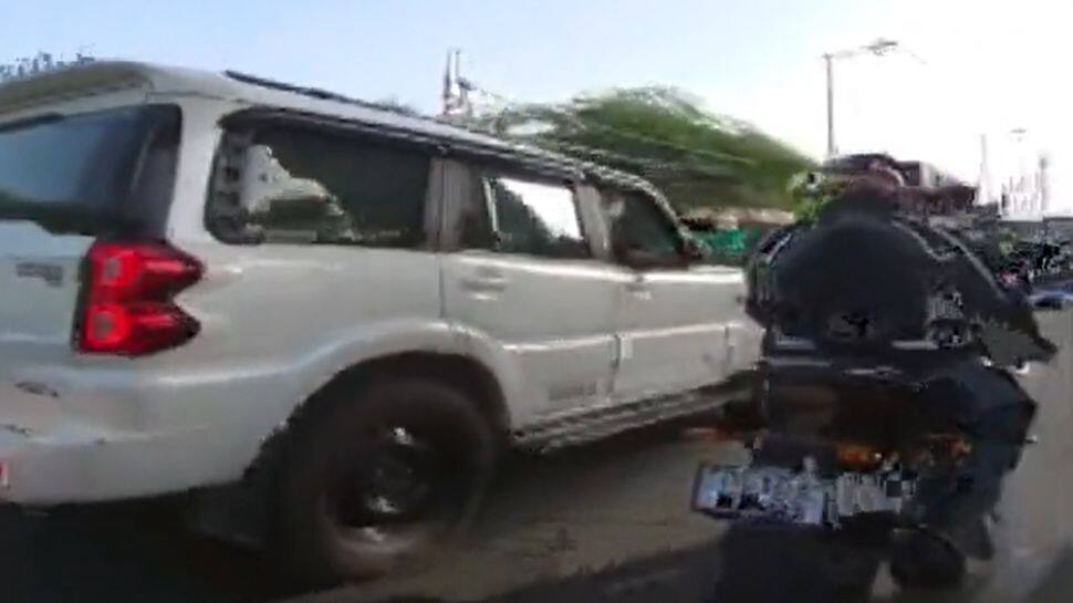 Delhi road rage: Scorpio driver hits biker, speeds off after heated argument - WATCH Delhi road rage: Scorpio driver hits biker, speeds off after heated argument - WATCH