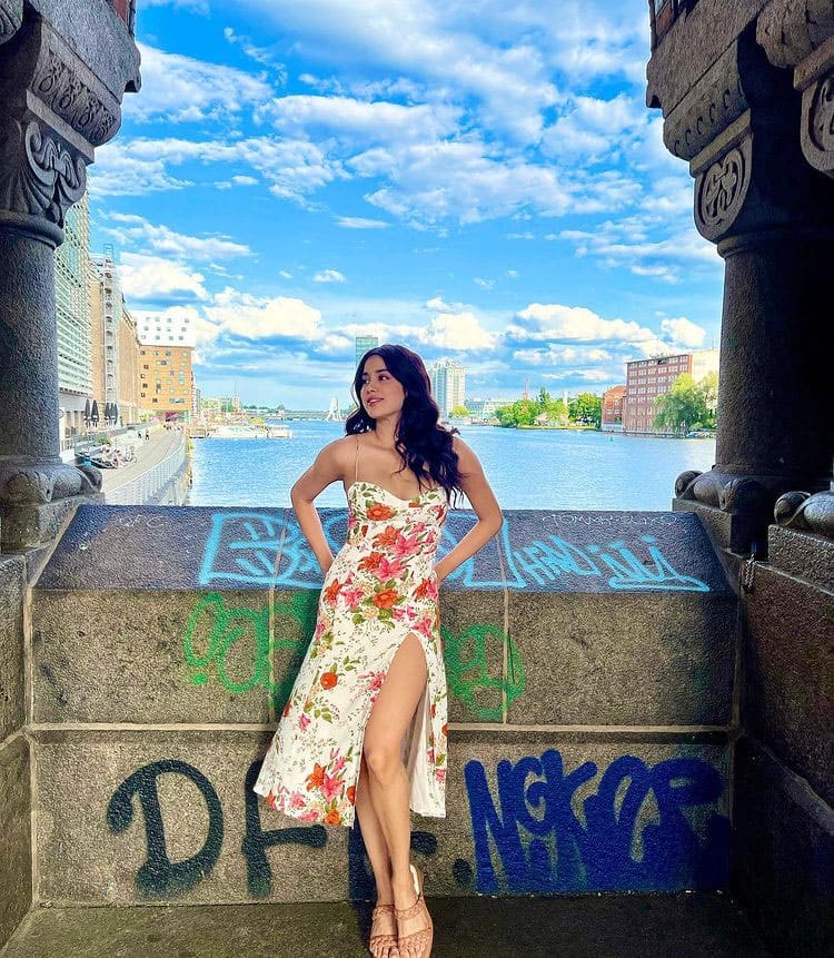 Janhvi Kapoors sunkissed pics in a floral thigh-high slit dress from Berlin are worth a dekko! | News | Zee News
