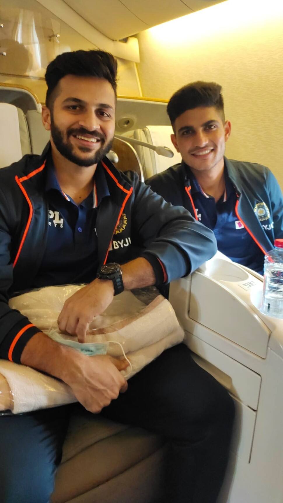 All-rounder Shardul Thakur (left) seen with opener Shubman Gill seem on the Emirate flight to UK. (Source: Twitter)