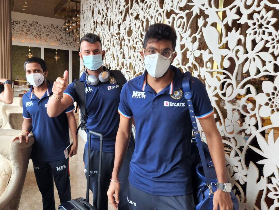 Team India vice-captain and pacer Jasprit Bumrah (right) with Cheteshwar Pujara at the Mumbai airport. (Source: Twitter)