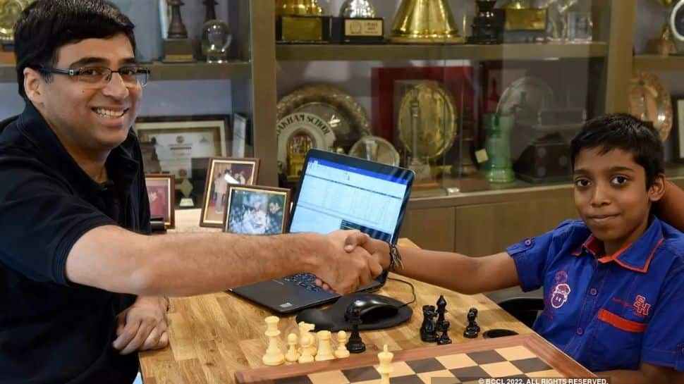 Rameshbabu Praggnanandhaa with Viswanathan Anand. Rameshbabu