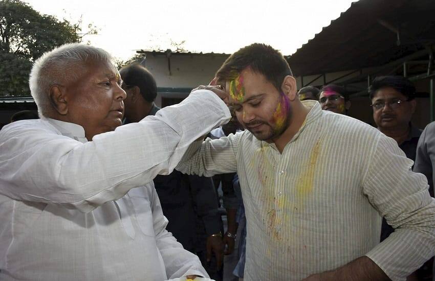 Tejashwi Yadav with Lalu Prasad Yadav