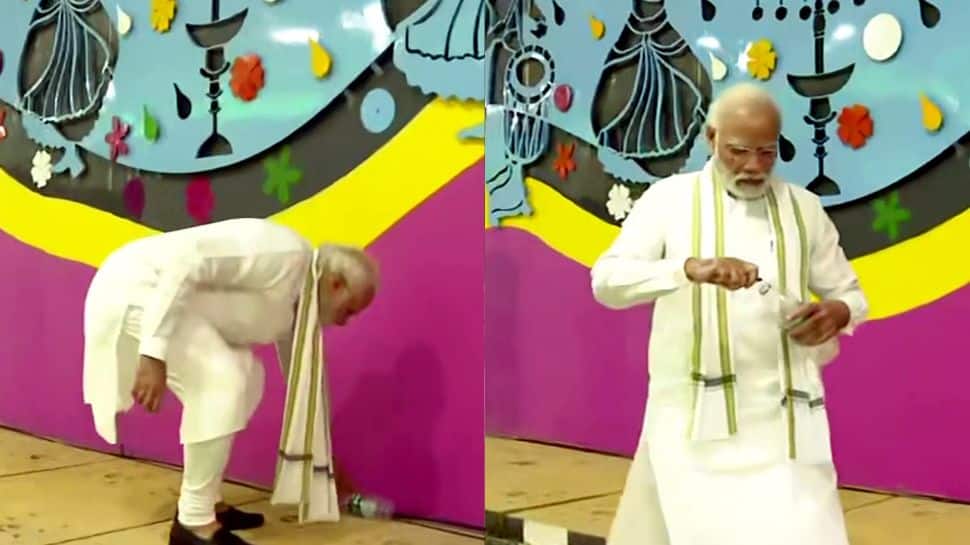 PM Narendra Modi picks up litter with bare hands during inspection of Pragati Maidan tunnel in Delhi - WATCH