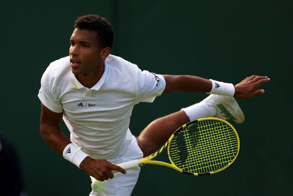 Felix Auger-Aliassime became the highest men's seed to exit this year's Wimbledon on Tuesday when serve-and-volley specialist Maxime Cressy sent the Canadian sixth seed packing with a 6-7(5), 6-4, 7-6(9), 7-6(5) win in the opening round. (Photo: Reuters)