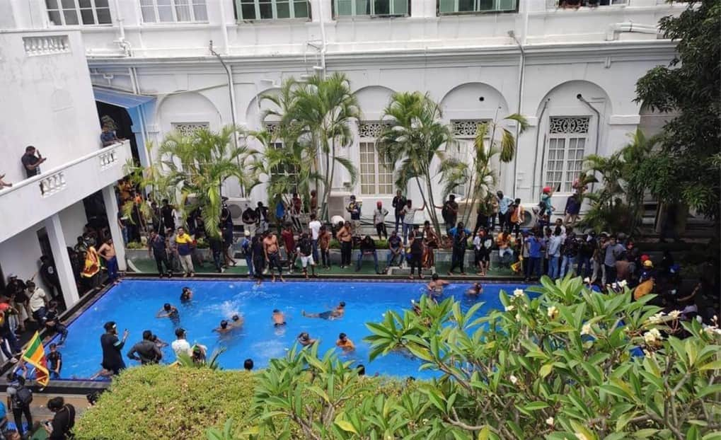 Hundreds of protesters splashing in the swimming pool at Sri Lanka President Gotabaya Rajapaksa's house