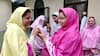 Women greet each other on the occasion of Eid-al-Adha