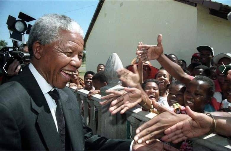 Nelson Mandela greets residents of Mmabatho