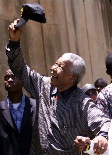 Nelson Mandela waves to a jubilant crowd in Jabulani