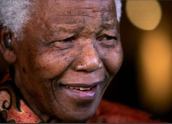 Nelson Mandela smiles as he formally announces his retirement from public life
