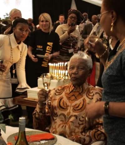 Nelson Mandela shares a toast with his wife Graca Mache 