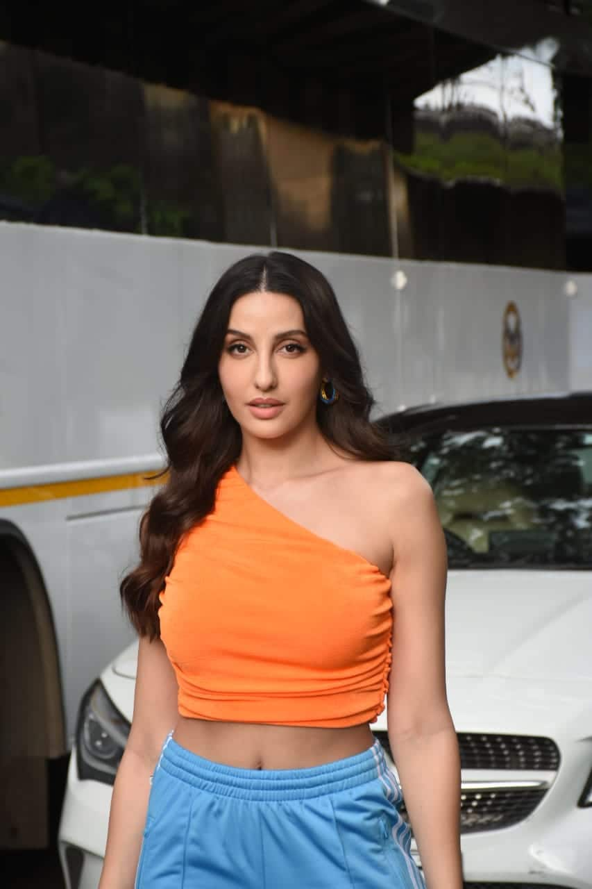 Nora Fatehi keeps it casual in off-shoulder orange top, denim