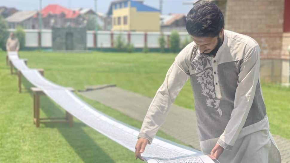 Kashmiri youth creates world record, writes Holy Quran on 500 metres scroll