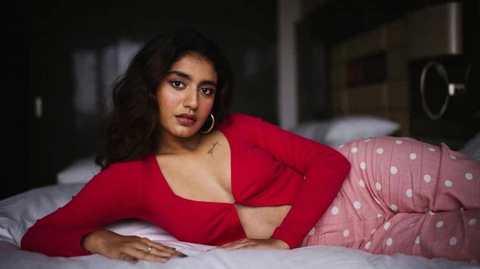 Prya Parkash Sexy Xxx - Priya Prakash Varrier goes BOLD in red hot plunging neckline, drops  Kesariya cover - Watch | Buzz News | Zee News