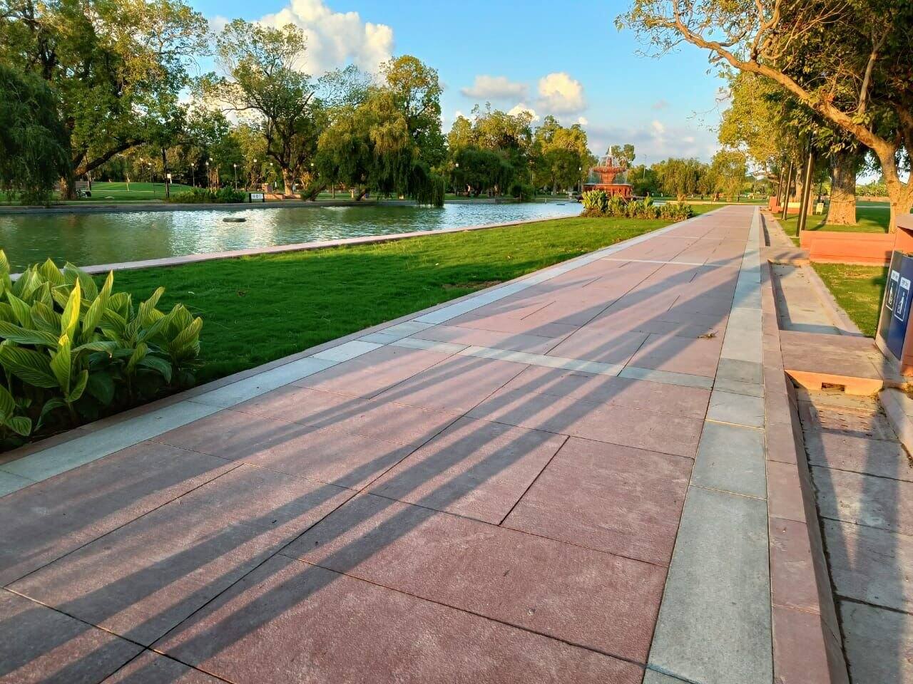 The project has greenery all around with red granite walkways