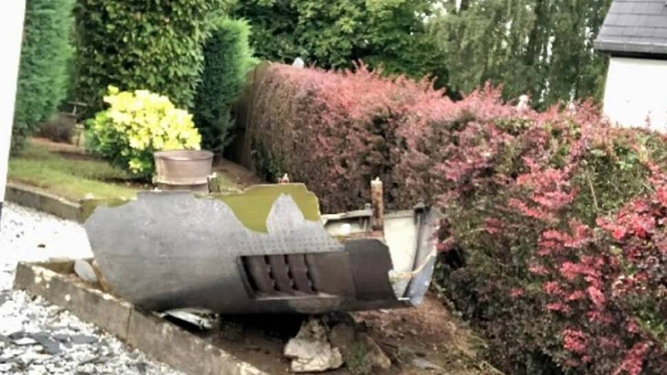 Engine part of a Boeing 747 plane falls at garage roof, residents in SHOCK