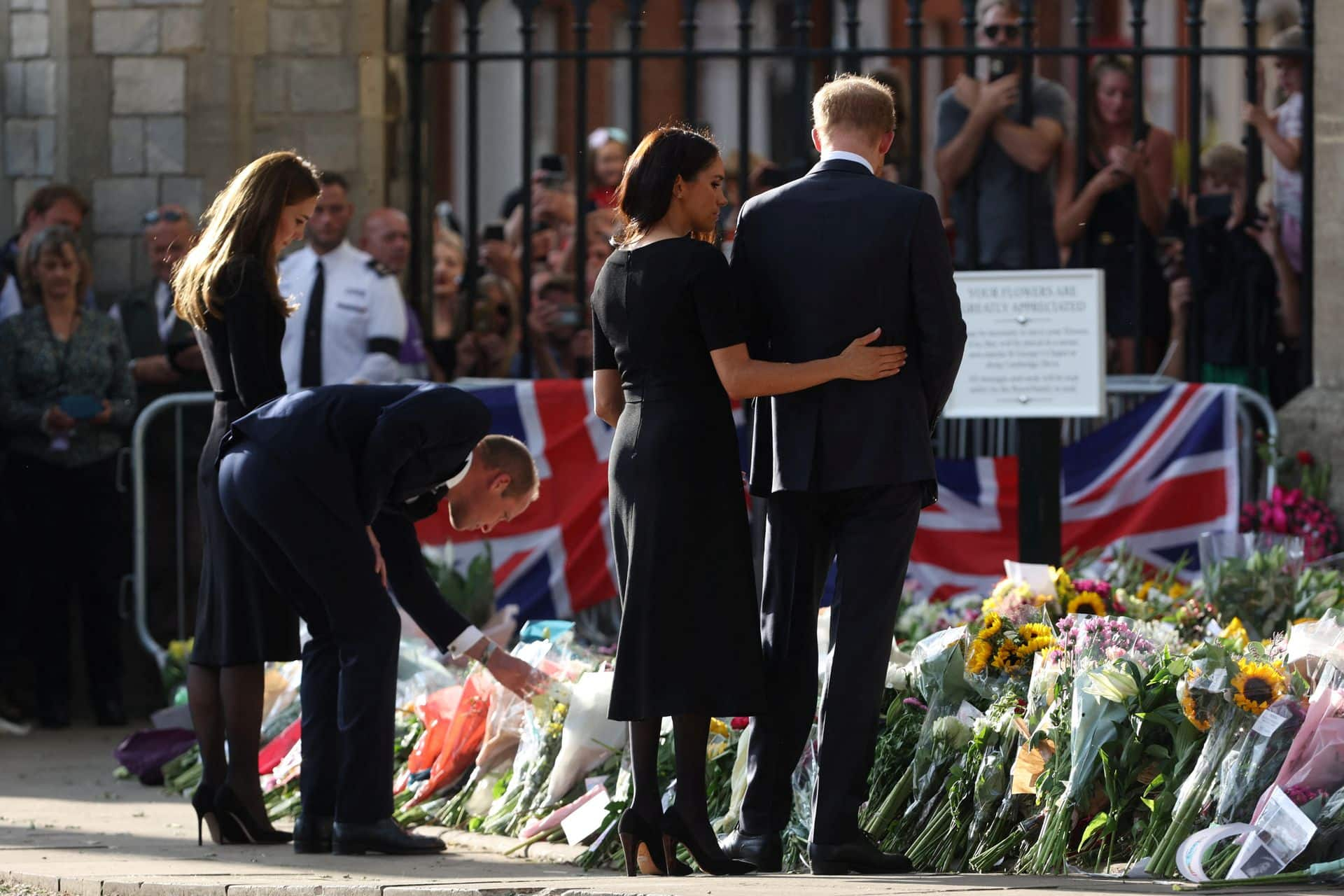 Prince William, Princess Catherine, Prince Harry and Meghan look at floral tribute