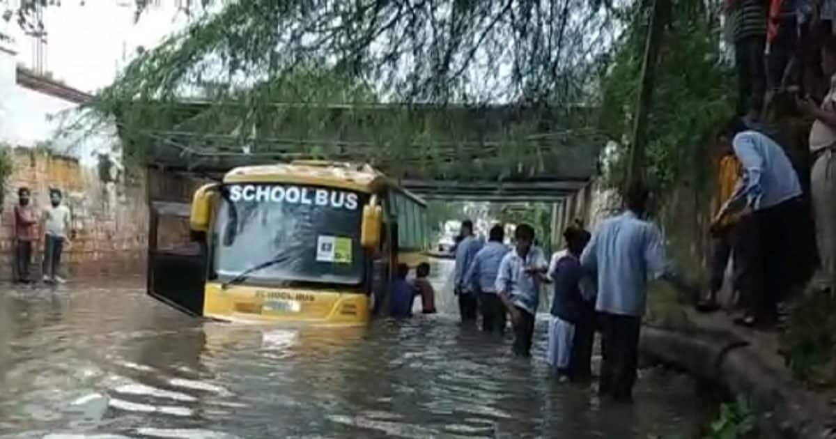 School Bus Stuck In Flooded Underpass 