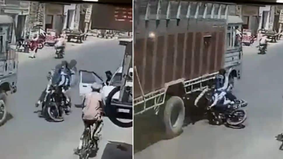 HORRIFIC Video! Bikers crashing into a moving truck shows why you should open car&#039;s door carefully?