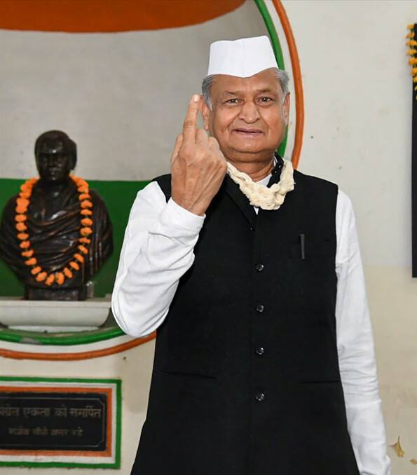 Ashok Gehlot shows his inked finger after casting vote for the Congress Party's presidential election in Jaipur